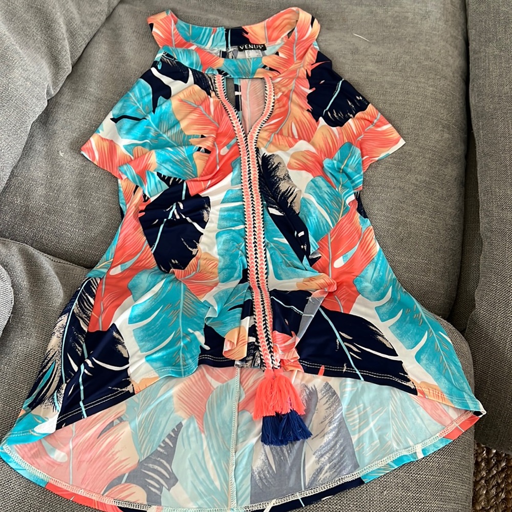 Never worn tropical tank top.